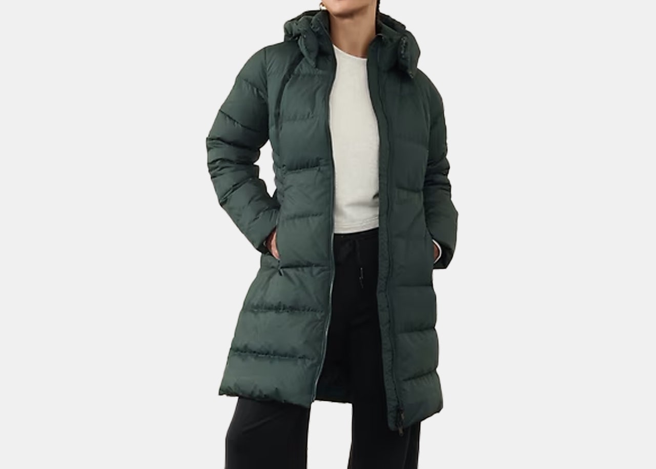 model wearing green winter puffer jacket