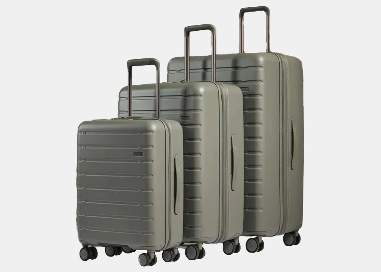 three green rolling suitcases